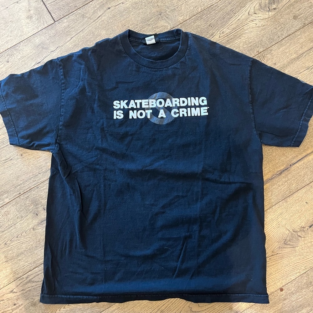 Vintage “Skateboarding Is Not A Crime” T-Shirt. Men’s Xl. Faded black.